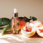 A bottle of lotion sitting next to some fruit
